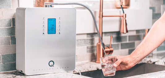 Filling up a glass of clean hydrating water from the Tyent Q Series alkaline water machine